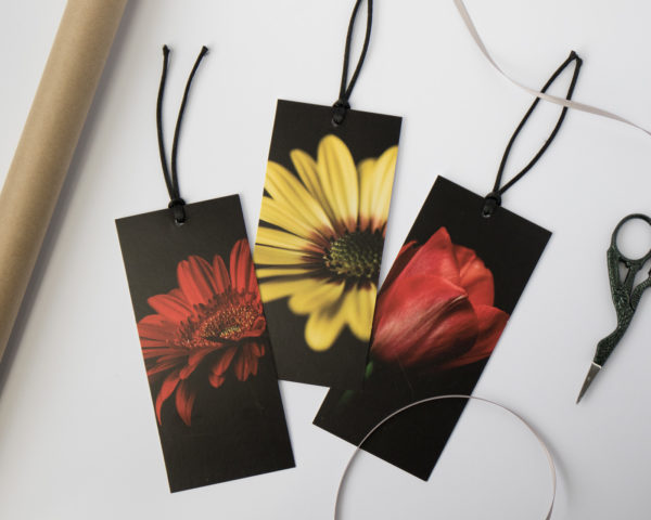three red and yellow flower gift tags